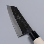 Closeup of the blade of a Nakamura Hamono Kurouchi Santoku Knife 165mm with maker name engraved