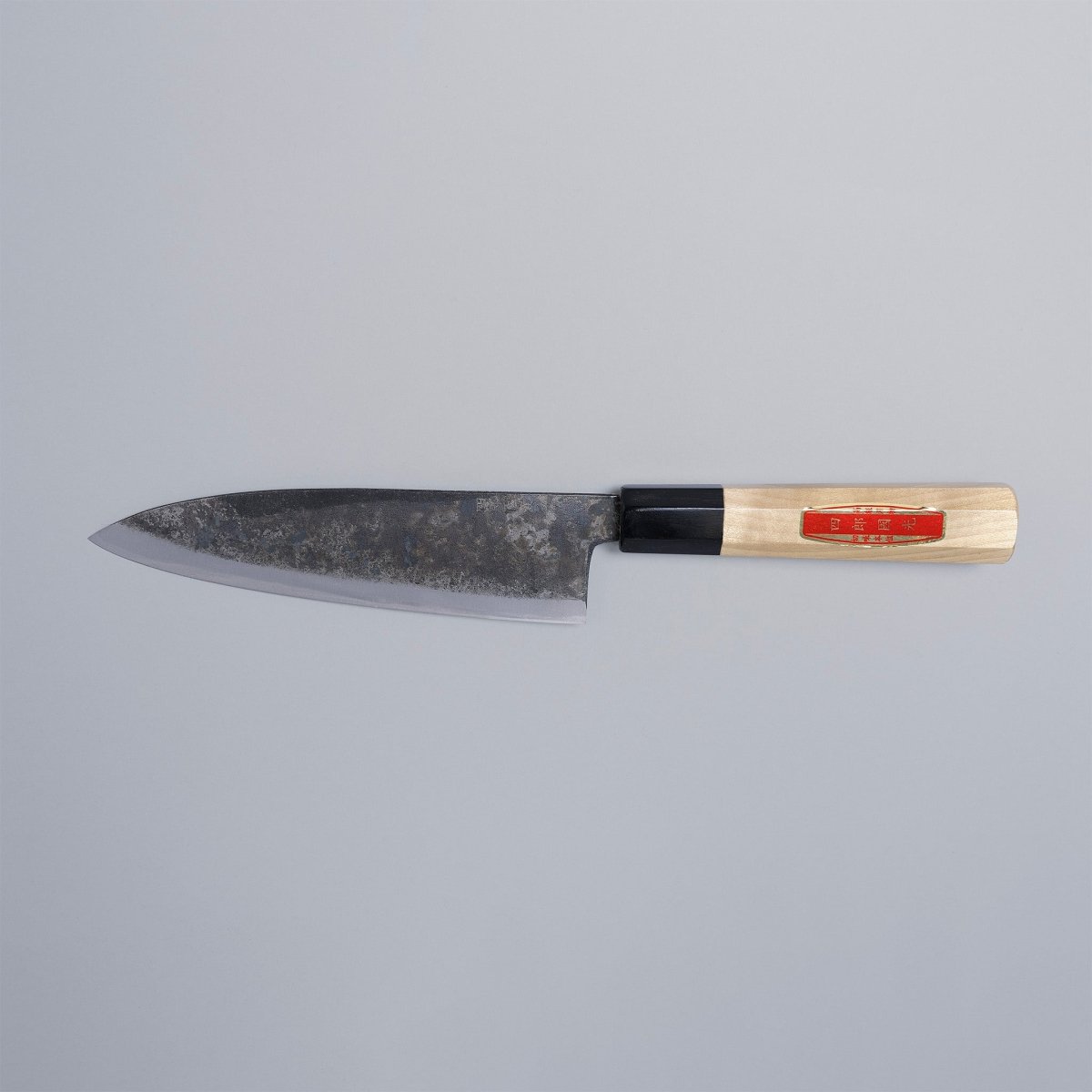 Special Kurouchi Vegetable Funayuki Knife 170mm crafted by Shirou Kunimitsu displayed horizontally on grey background