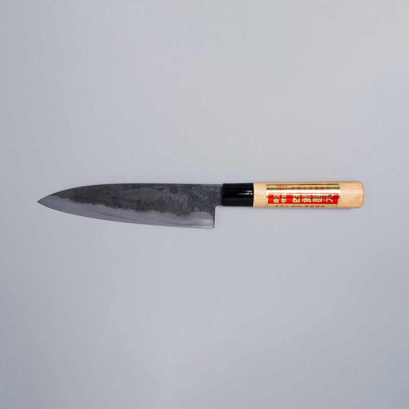 Single-Bevel Kurouchi Santoku Knife 170mm crafted by Shirou Kunimitsu displayed horizontally on grey background