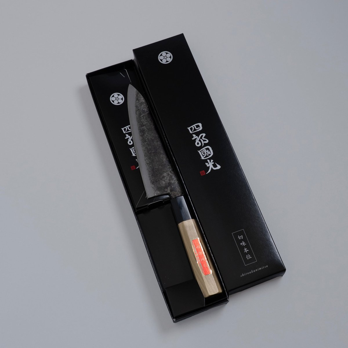 Special Kurouchi Vegetable Funayuki Knife 170mm crafted by Shirou Kunimitsu in black box on grey background