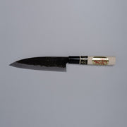Kurouchi Deba knife 155mm crafted by Shigemitsu Hamono displayed horizontally on grey background 