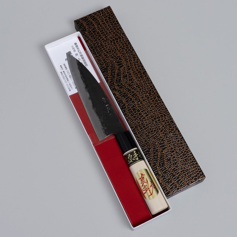 Kurouchi Deba knife 155mm crafted by Shigemitsu Hamono in decorative box on grey background 