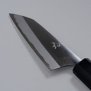 Closeup of the blade of a Nishida Hamono Polished Petty Knife 100mm with maker's engraving