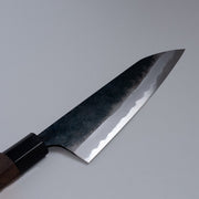 Closeup of the blade of a Nishida Hamono Kurouchi Gyuto Knife 165mm