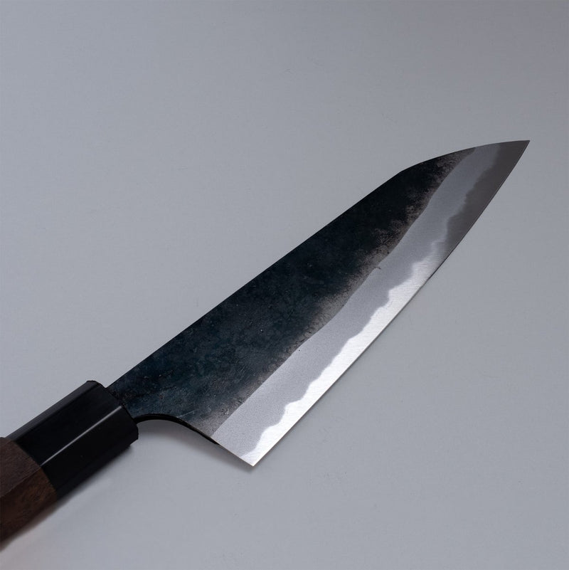Closeup of the blade of a Nishida Hamono Kurouchi Gyuto Knife 165mm