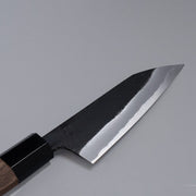 Closeup of the blade of a Nishida Hamono Kurouchi Petty Knife 100mm