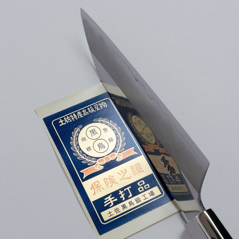 Ginsan stainless Petty knife 135mm crafted by Kurotori Blacksmith on grey background with certificate of authenticity