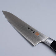 Closeup of the blade of a Inoguchi Hamono Western Santoku Knife 21cm with maker's engraving