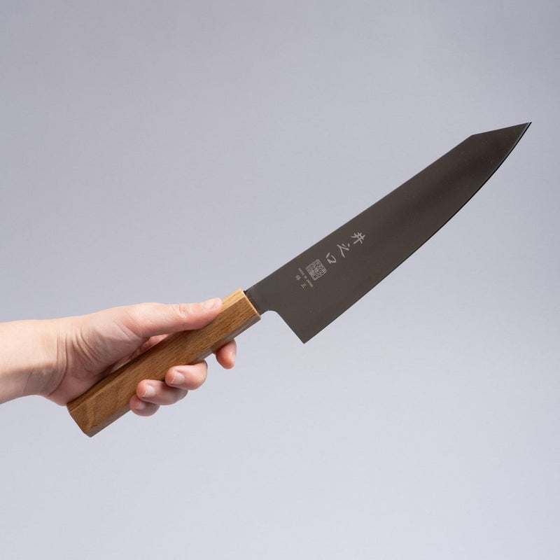 Hand holding a Inoguchi Hamono Japanese Kiritsuke Santoku Knife 210mm (Japanese Oak)