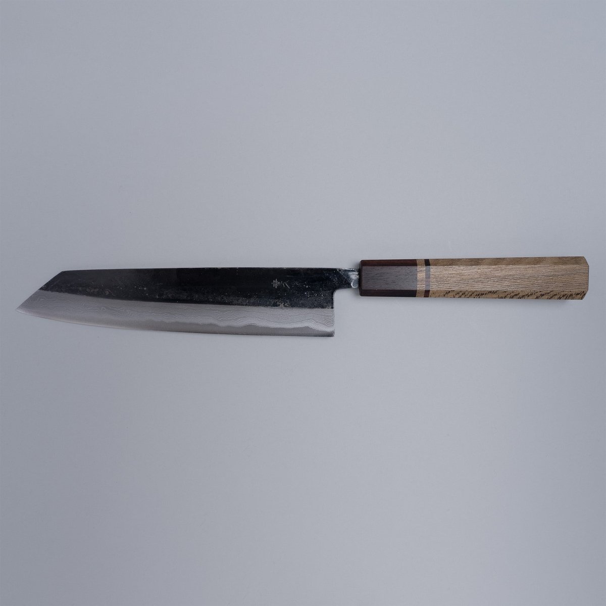 Kurouchi Damascus Blue Steel No. 2 Kiritsuke 210mm by Kajihara Hamono displayed horizontally on grey background