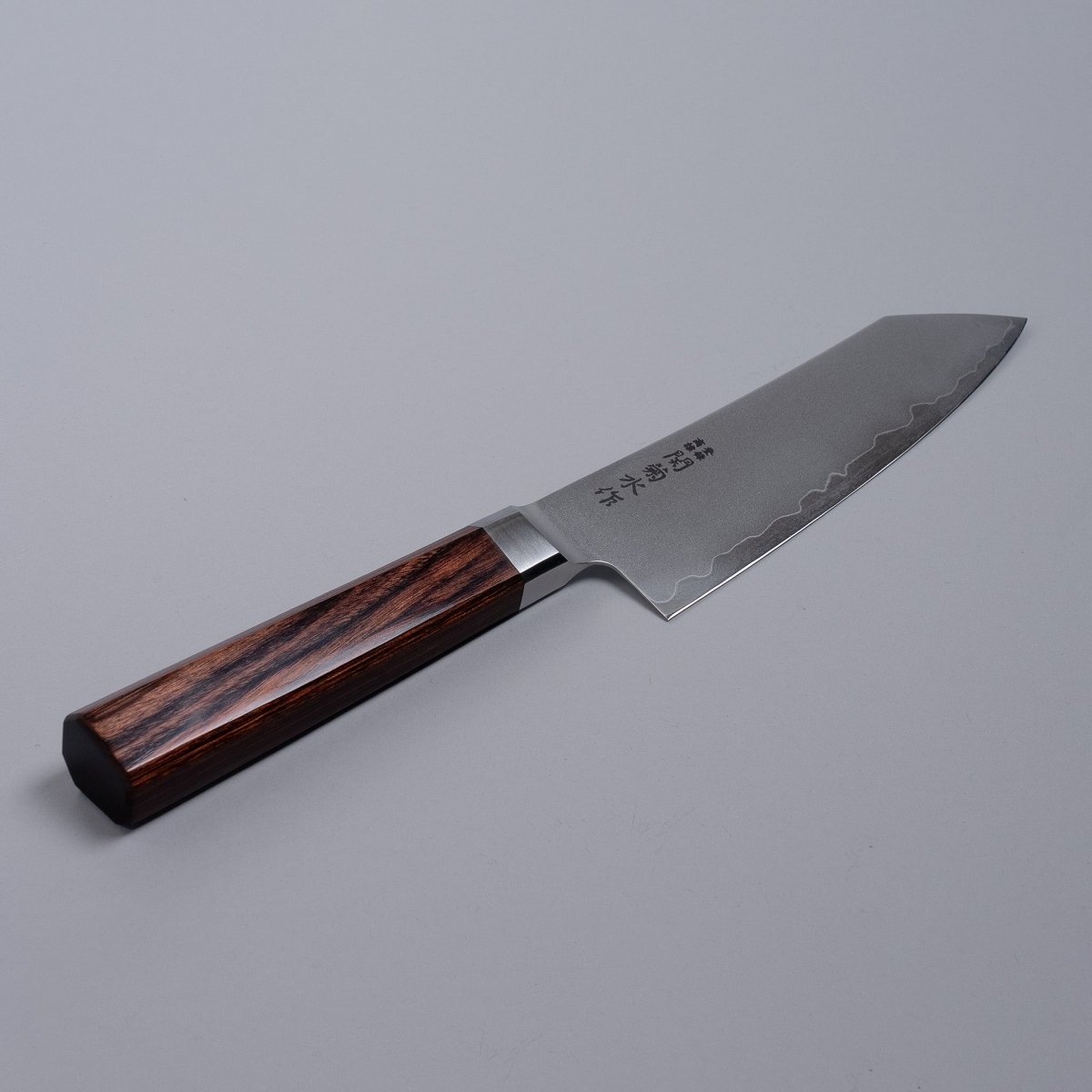 VG-10 stainless steel KIRINAMI Kiritsuke Bunka 150mm crafted by Seki Kikusui Cutlery displayed diagonally on grey background