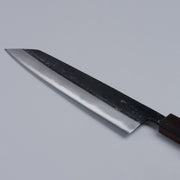 Closeup on blade of Kurouchi Damascus Blue Steel No. 2 Kiritsuke 210mm by Kajihara Hamono displayed diagonally on grey background