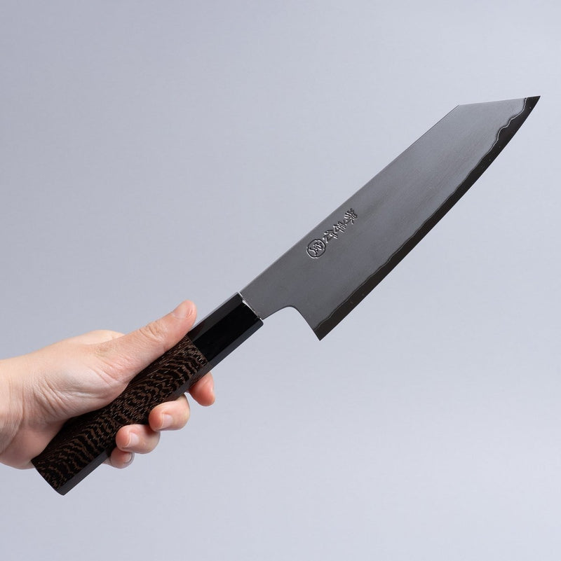 Hand holding a Sakai TAKAYUKI White Steel No.2 Kiritsuke 180mm