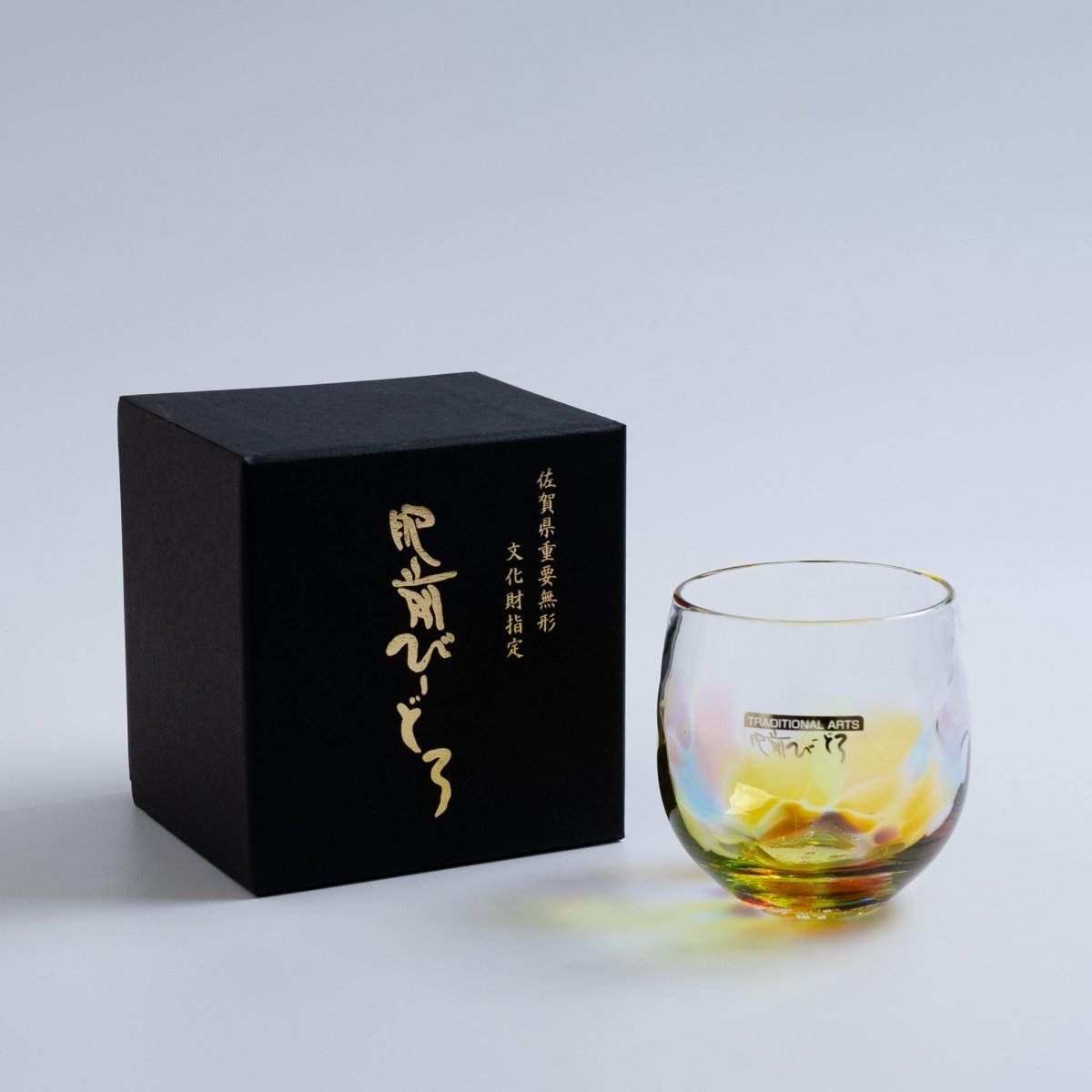 Soejima Glassware Handcrafted Round Rainbow Glass next to its black box