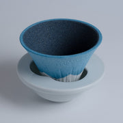 Closeup of COFIL Mount Fuji Ceramic Coffee Filter mounted on the saucer