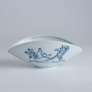 Closeup of the side of Koenji Sugagasa Porcelain Appetizer Plate with frolicking animals print