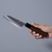 Hand holding a Nishida Hamono Polished Petty Knife 100mm