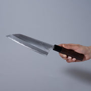 Hand holding a Nishida Hamono Polished Gyuto Knife 165mm
