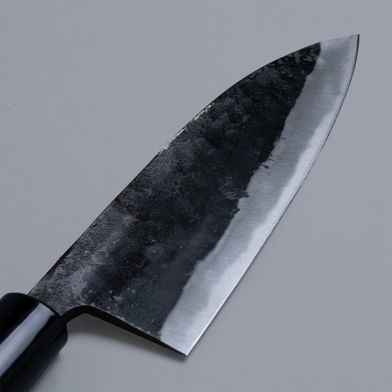 Closeup of the blade of a Nakamura Hamono Kurouchi Deba Knife 210mm
