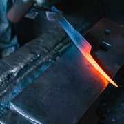 Closeup of a heated blade in the anvil