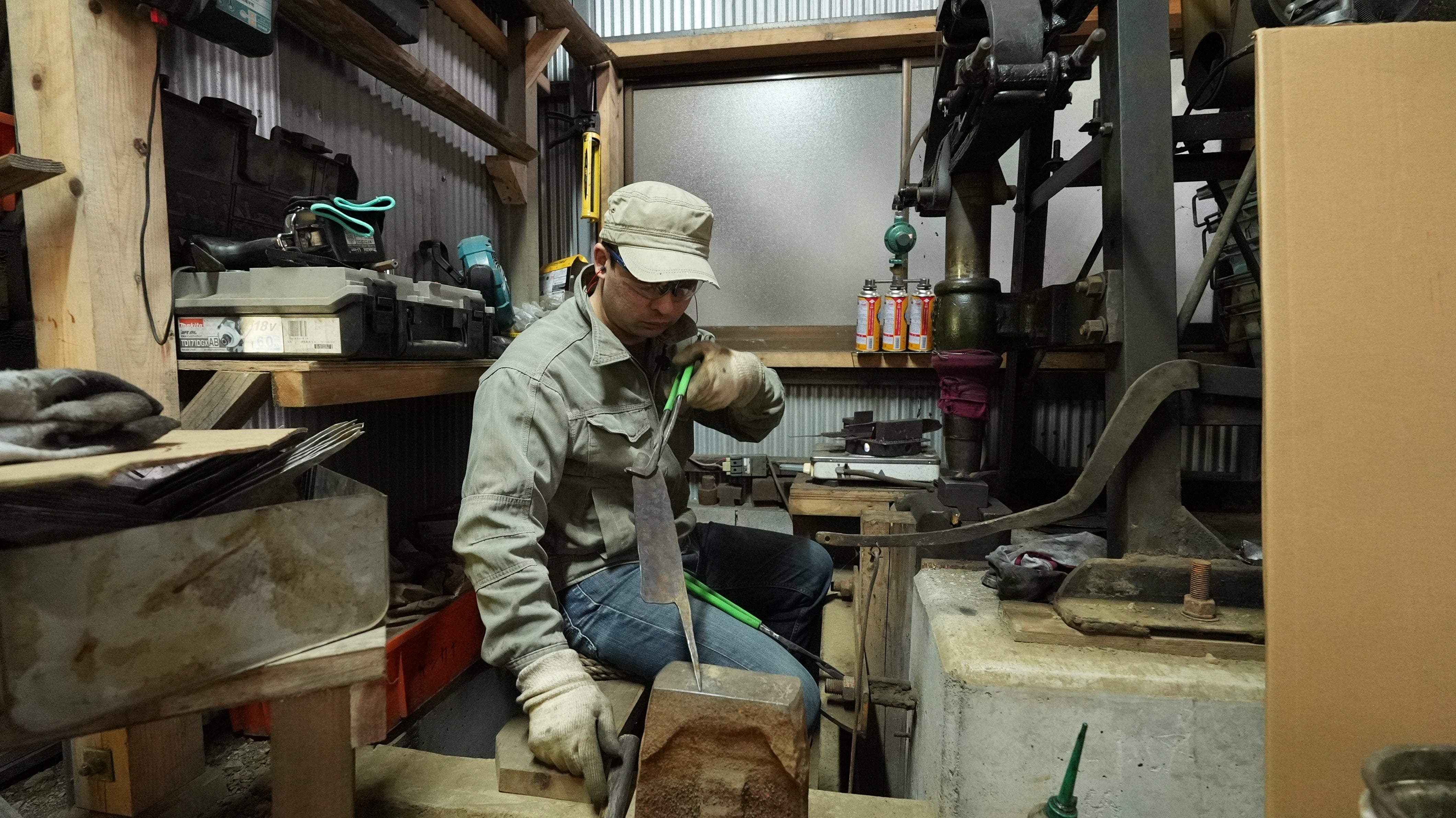 Kyohei Shindo examining a knife blade in his workshop