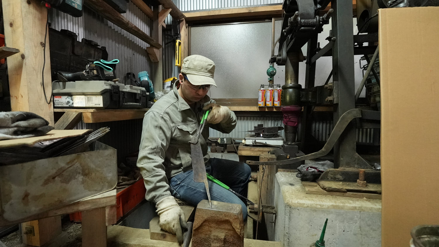 Kyohei Shindo examining a knife blade in his workshop
