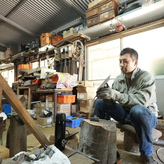 Kyohei Shindo crafting traditional Aogami No 2 kurouchi kitchen knife in his workshop in Kochi, Japan