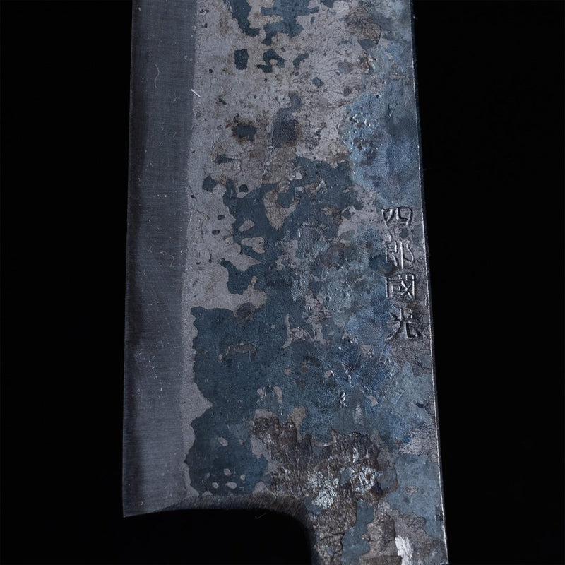 Closeup of the artisan name engraving in the Shirou Kunimitsu Special White Steel Kurouchi Gyuto Knife 210mm blade