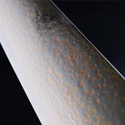 Closeup on blade texture of Takeshi Saji VG-10W Stainless Steel Nakiri 170mm on a dark background