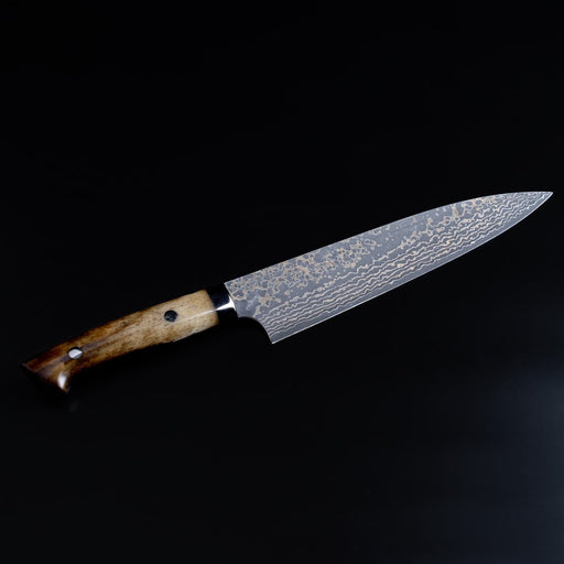 Takeshi Saji VG10W Stainless Steel Gyuto 200mm Gold-Toned Finish displayed diagonally on black background