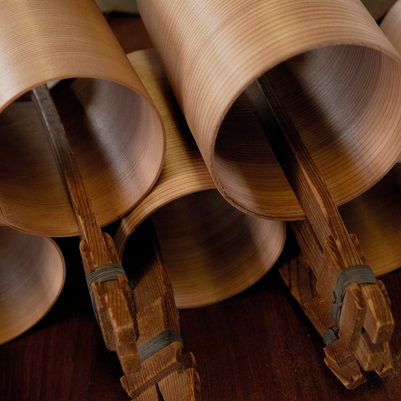 Closeup of wooden pieces in round shapes inside Hakata Bentwood Tamaki workshop