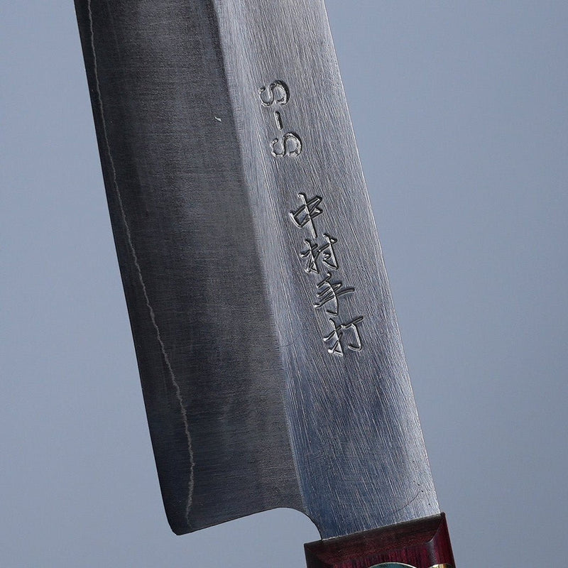 Closeup of the artisan name engraving on the blade of a Nakamura Blacksmith HAP40 Gyuto 200mm