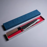 Kyohei Shindo Kurouchi Kiritsuke Gyuto 220mm crafted from Aogami 2 in Kochi, Japan in decorative box on grey background
