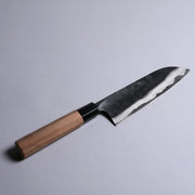 Kyohei Shindo Kurouchi Santoku 170mm crafted from Aogami 2 in Kochi, Japan displayed diagonally on grey background