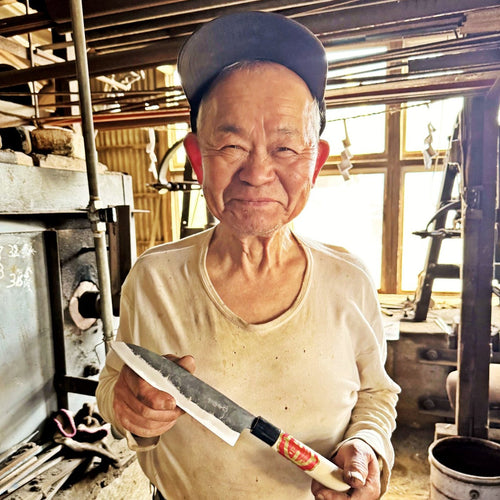 Portrait of Nakamura Blacksmith main artisan holding a knife
