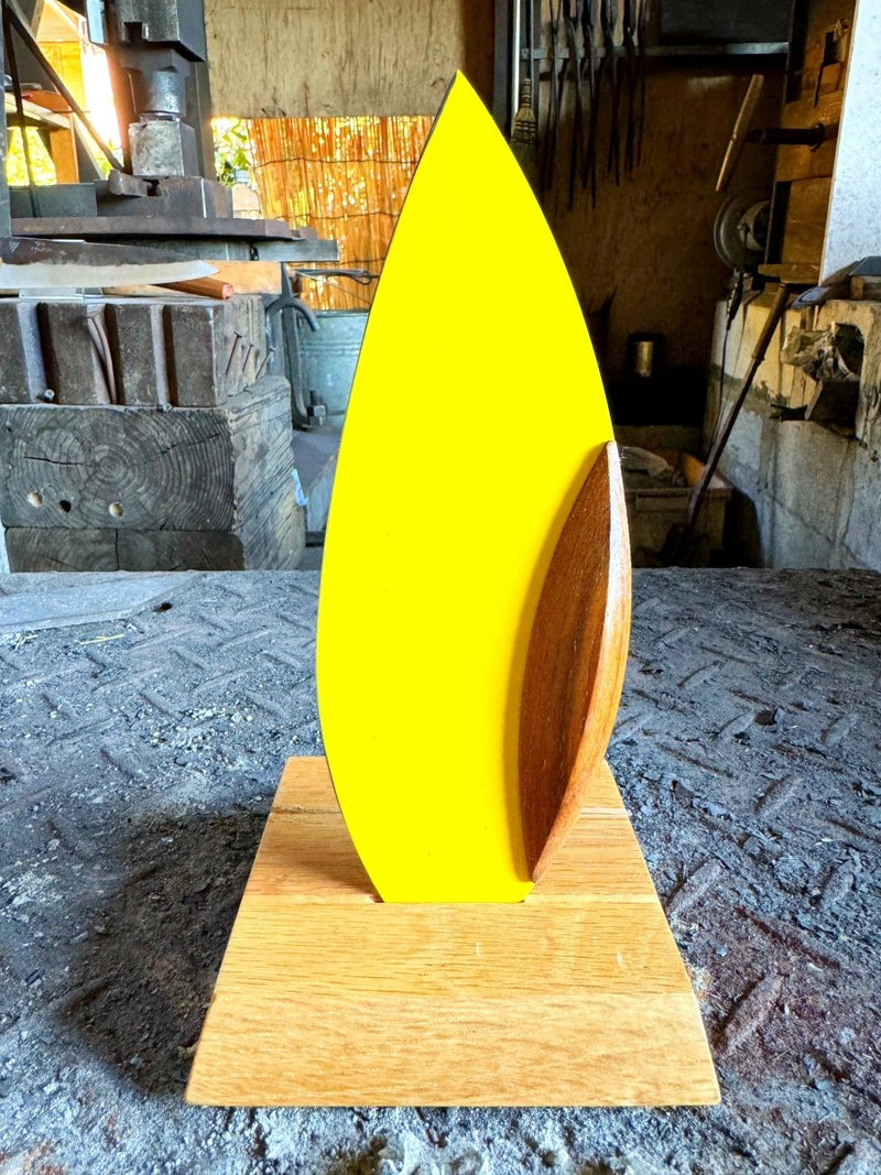 Yellow 'Happa' Leaf Shaped All - Around Knife by Asano Blacksmith in its dedicated stand inside the workshop