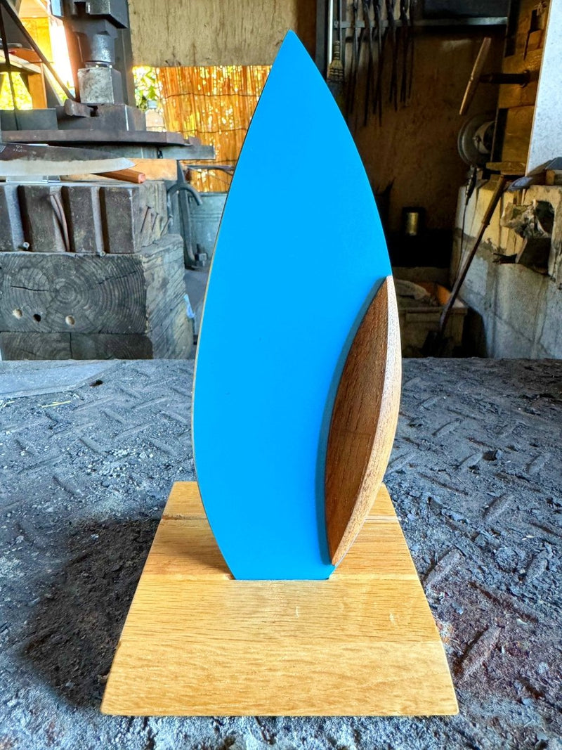 Blue 'Happa' Leaf Shaped All - Around Knife by Asano Blacksmith in its dedicated stand inside the workshop