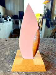 Pink 'Happa' Leaf Shaped All - Around Knife by Asano Blacksmith in its dedicated stand inside the workshop