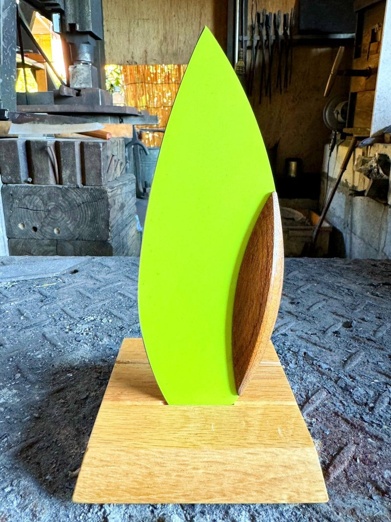 Green 'Happa' Leaf Shaped All - Around Knife by Asano Blacksmith in its dedicated stand inside the workshop
