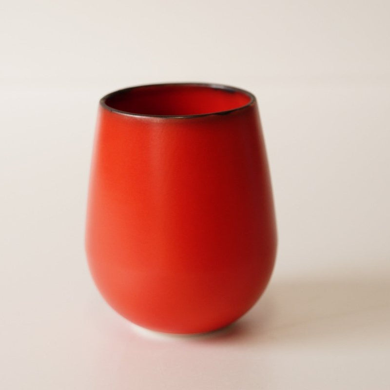 Red Round Porcelain Cup crafted by Imari Togei craftsmen on light grey background