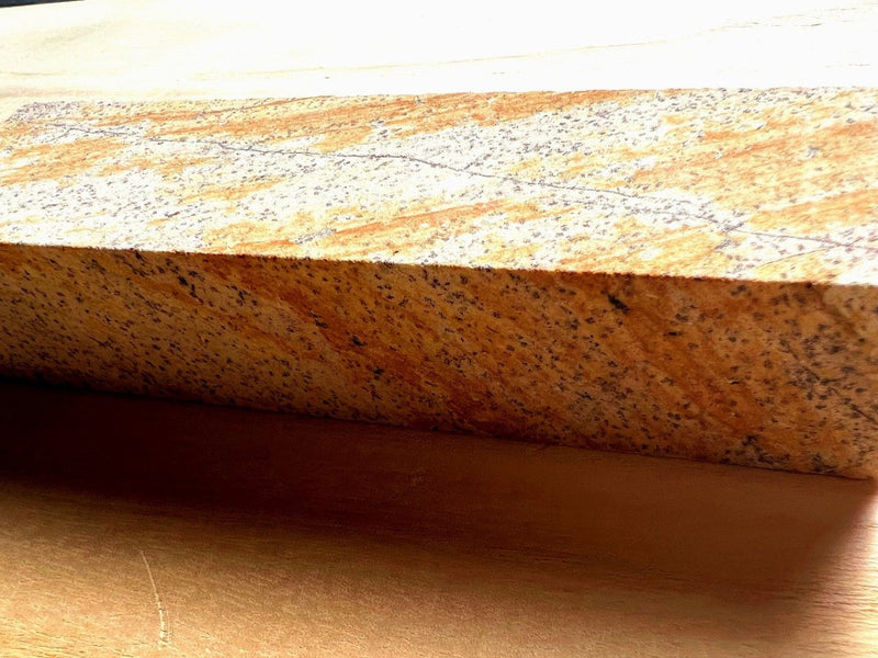 Closeup of the Amakusa Red Sharpening Stone included for free with the knife