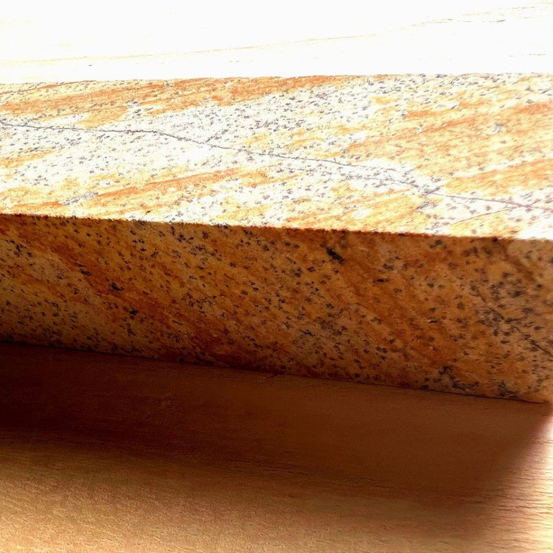 Closeup on natural red sharpening stone included with Kawasaki Blacksmith knives