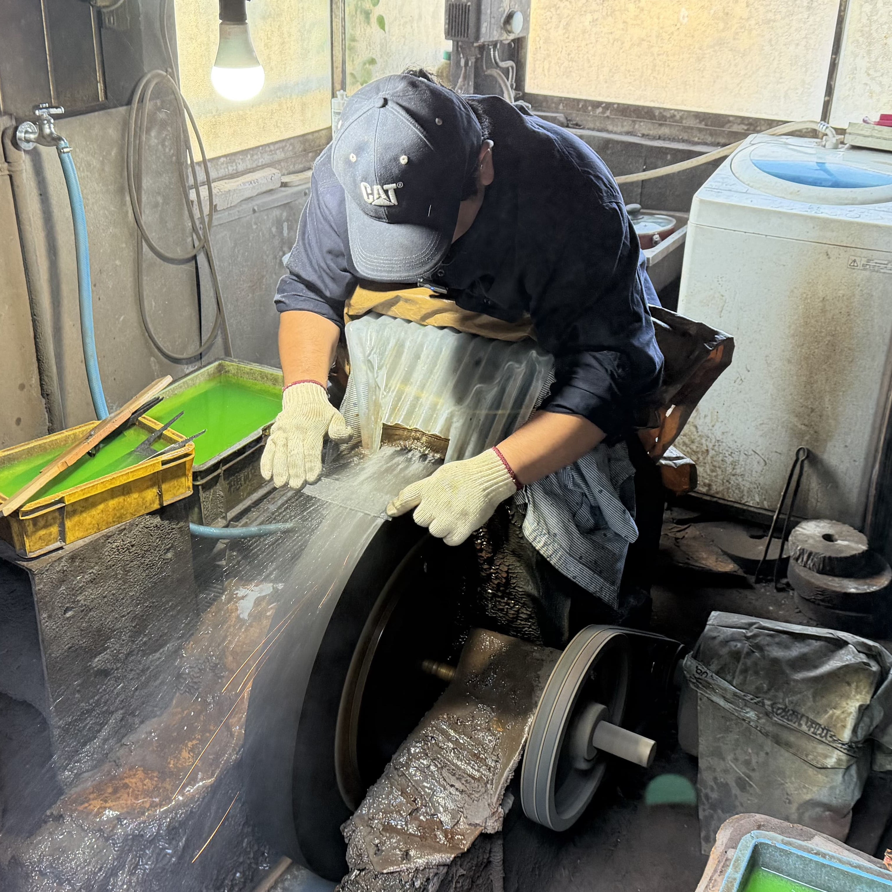 Kajihara Hamono maker polishing a knife