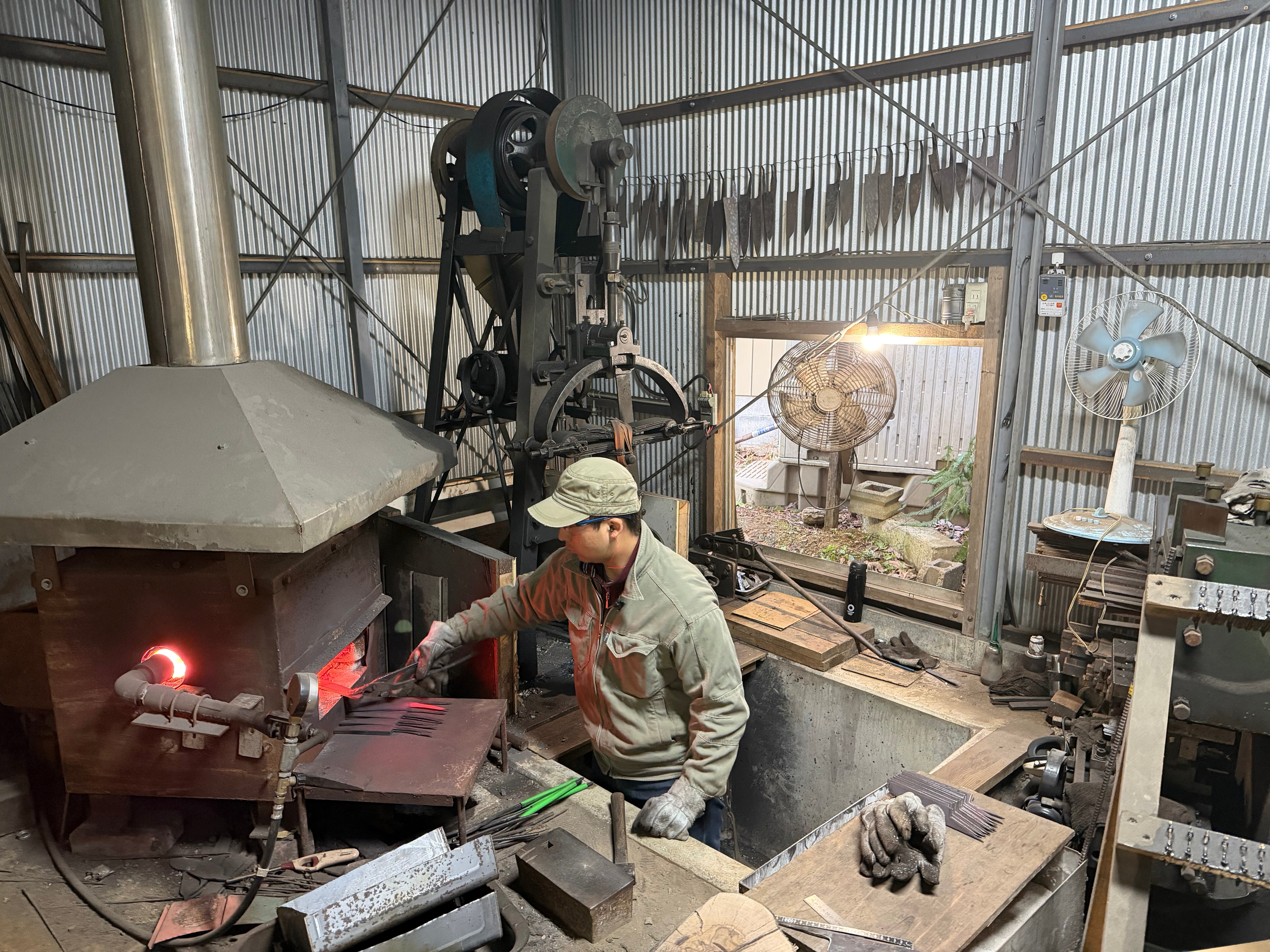 Kyohei Shindo heating some knife blades in his workshop