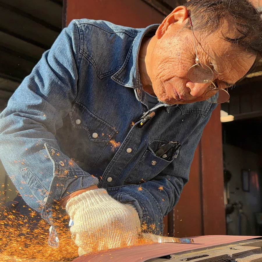 Portrait of Bizen Osafune Swordsmith polishing a blade
