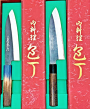 Two Kurouchi Santoku Knives 180mm by Yamawaki Hamono with blue/brown and dark brown handles in red boxes with green lining