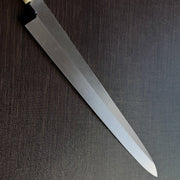 Close-up of the Bizen Osafune Tamahagane Sashimi Knife 310mm blade showing the mirror-polished tamahagane steel surface