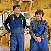 Smiling portrait of MOCKATS master craftsman and her coworker and mon inside the workshop