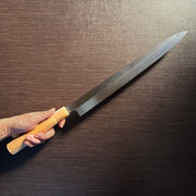 Bizen Osafune Tamahagane Sashimi Knife 310mm held in hand showcasing the impressive 310mm blade length and magnolia wood handle