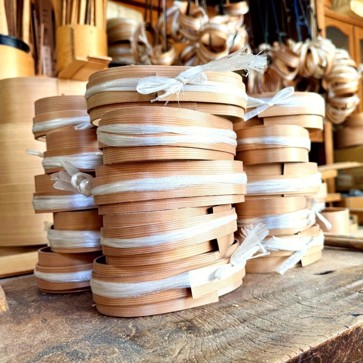 Stacked Magewappa Oval Bento boxes ready for packaging inside the Hakata Bentwood Tamaki workshop